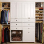 White Wall Closet with Decorative Foil Doors and Crown Mould