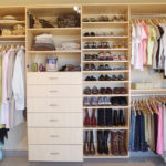 Wall Closet in Maple Woodgrain with Glass Doors and Tilted Shoe Shelves with Rails