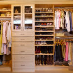 Wall Closet in Maple Woodgrain with Glass Doors and Tilted Shoe Shelves with Rails