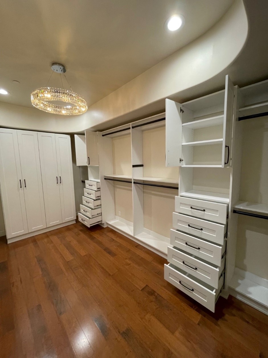 Closet Trends hero photo 5 - empty white closet with chandelier